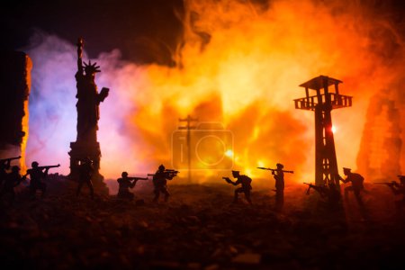 Foto de Conceptual image of war between Democracy and dictatorship using toy soldiers. Battle in ruined city. Selective focus - Imagen libre de derechos
