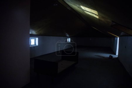 Photo for Mysterious mood created by white light in the window, subtle illuminated floor and total darkness around or Empty room with dramatic light entering the window. - Royalty Free Image