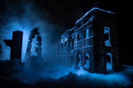 War apocalypse concept. Snow covered ruined city destroyed by war. Creative artwork decoration in dark. Selective focus