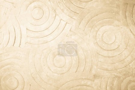 Cream concrete texture wall background. Abstract beige paint floor stamped concrete surface clean polished on walkway in garden. Wallpaper pattern curved circle rough brown cement stone decorative.