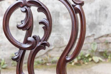 Close-Up of Wooden Chair with Ornate Floral Carvings