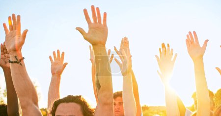 Téléchargez les photos : Close up of volunteers hands of diverse people and different ages. A group of happy eco activists putting, raising hands up to the sky. Friendship, teamwork, volunteering concept. - en image libre de droit