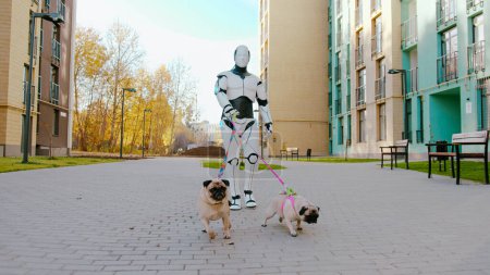 Two cute pugs on long leashes walking with modern humanoid robot outdoors. Futuristic machine performing domestic actions with help of artificial intelligence.