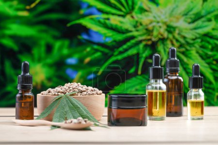 Photo for The concept of combining legalized cannabis and dermatology. CBD oil in bottle with dropper lid, mockup cream jar for skincare purpose. - Royalty Free Image