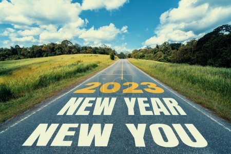 Photo for 2023 New Year road trip travel and future vision concept . Nature landscape with highway road leading forward to happy new year celebration in the beginning of 2023 for fresh and successful start . - Royalty Free Image