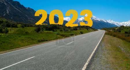 Photo for 2023 New Year road trip travel and future vision concept . Nature landscape with highway road leading forward to happy new year celebration in the beginning of 2023 for fresh and successful start . - Royalty Free Image