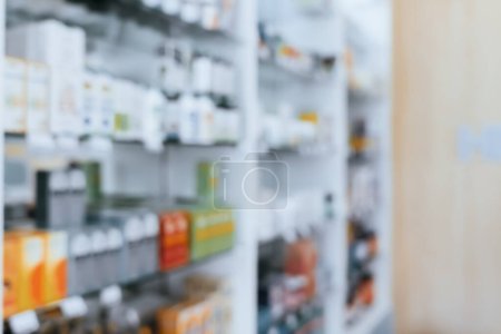 Photo for Pharmacy blurred abstract background qualified drug, medicinal product on shelf background. Blurry light tone wallpaper of drugstores interior medications displayed on shelves for healthcare concept. - Royalty Free Image