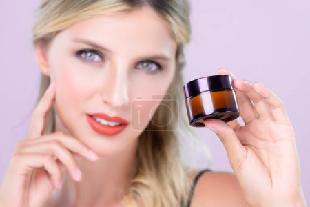 Photo for Closeup alluring beautiful perfect cosmetic skin woman portrait hold mockup jar cream moisturizer for skincare treatment, anti-aging product in pink isolated background. Natural healthy skin concept - Royalty Free Image