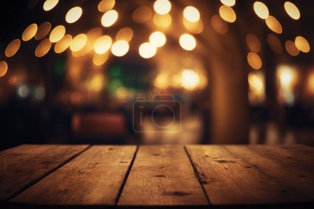 Foto de Empty wood table for product display in blur background of admirable restaurant at night - Imagen libre de derechos