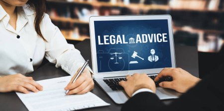 Smart legal advice website for people searching for astute law knowledge in laptop computer on a desk in library of university or college