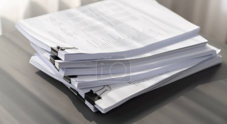 Photo for Closeup office table with organized stacked papers, as the concept of organized document management system for busy business reports or legal papers. equility - Royalty Free Image
