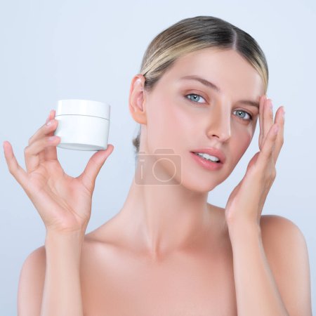 Photo for Alluring beautiful perfect cosmetic skin woman portrait hold mockup jar cream or moisturizer for skincare treatment, anti-aging product in isolated background. Natural healthy skin model concept. - Royalty Free Image