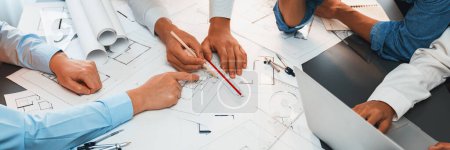 Architect or engineer working on building blueprint, contractor designing and drawing blueprint layout with tool for construction project. Civil engineer and architecture design concept. Insight Stickers 659191700