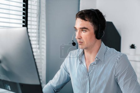 Photo for Competent male operator working with customers in the office. Concept of an operator, customer service agent working in the office. - Royalty Free Image