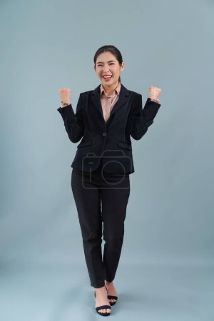 Photo for Confident young asian businesswoman in formal suit making hand gesture to indicate promotion or advertising with surprised face expression and gesture on isolated background. Enthusiastic - Royalty Free Image