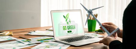 Photo for Go green for environmental awareness concept display on laptop on eco-friendly company meeting with businessman initiate environmental protection for clean and sustainable future ecology. Trailblazing - Royalty Free Image