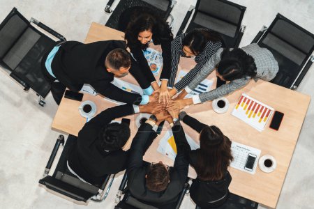 Photo for Happy business people celebrate teamwork success together with joy at office table shot from top view . Young businessman and businesswoman workers express cheerful victory show unity support . Jivy - Royalty Free Image