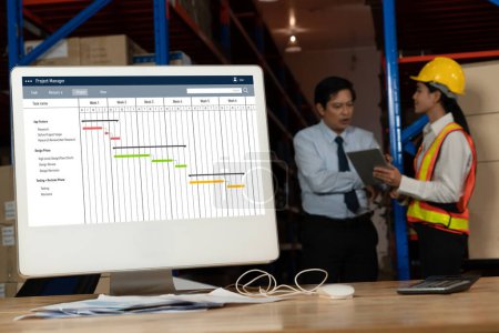 Foto de Software de planificación de proyectos para la gestión de proyectos empresariales modish en la pantalla del ordenador que muestra la tabla de la línea de tiempo del proyecto del equipo - Imagen libre de derechos