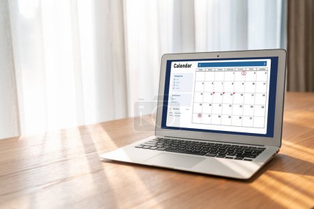 Photo for Calendar on computer software application for modish schedule planning for personal organizer and online business - Royalty Free Image