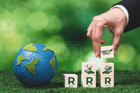Photo for Businessman hand with paper globe and net zero symbol cube for eco awareness. Ethical company reduce CO2 emission, fight climate change and global warming by clean energy for green environment. Alter - Royalty Free Image
