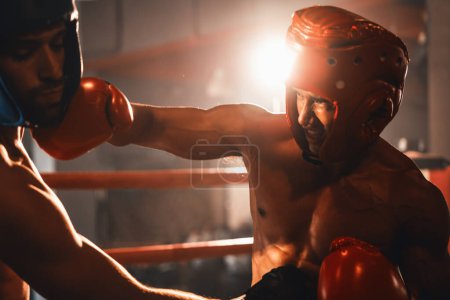 Photo for Two athletic and muscular body boxers with safety helmet or boxing head guard face off in fierce boxing match. Boxing fighter competitor fighting in the boxing ring. Impetus - Royalty Free Image