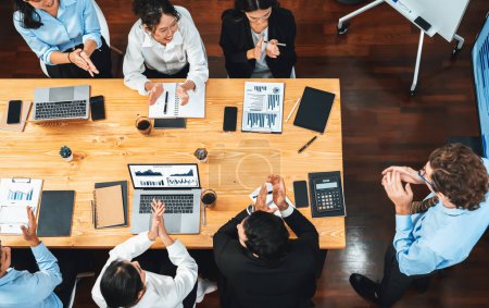Photo for Panorama top view diverse group of business analyst team analyzing financial data report paper on meeting table. Chart and graph dashboard by business intelligence analysis. Meticulous - Royalty Free Image