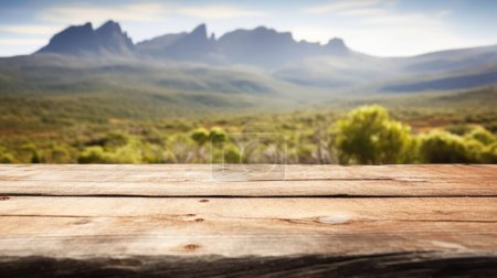 Foto de La mesa marrón de madera vacía con fondo borroso de la montaña Cradle en Tasmania. Imagen exuberante. - Imagen libre de derechos