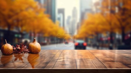 Foto de La mesa de madera vacía con fondo borroso del distrito de negocios y el edificio de oficinas en otoño. Imagen exuberante. - Imagen libre de derechos