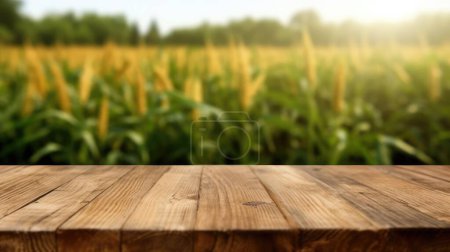 Photo for The empty wooden brown table top with blur background of corn field. Exuberant image. - Royalty Free Image