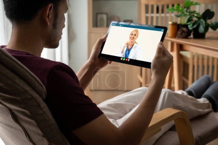 Photo for Doctor video call online by modish telemedicine software application for virtual meeting with patient - Royalty Free Image