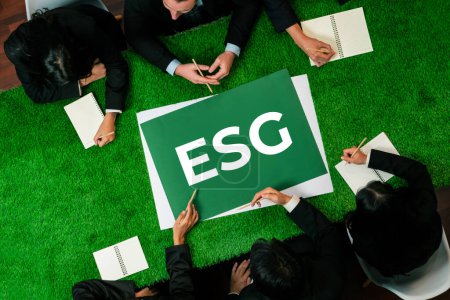 Photo for Top view panoramic banner ESG symbol on green grass meeting table with group of diverse business people planning marketing with eco-friendly awareness as environmental social governance concept.Quaint - Royalty Free Image