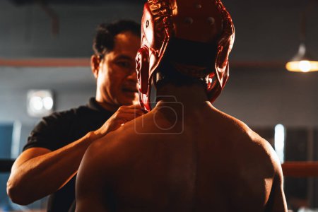 Photo for Referee explain rules and make preparation before give signal for the boxing match, boxer with safety helmet or head guard on the ring, ready to fight. Impetus - Royalty Free Image