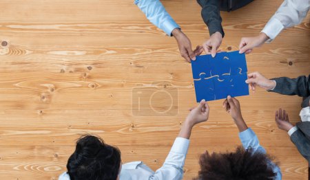 Photo for Panorama top view diverse corporate officer worker collaborate in office connect puzzle piece as partnership and teamwork concept. Unity and synergy in business success with jigsaw puzzle. Concord - Royalty Free Image
