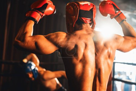 Photo for Boxer and intimidation with victory or winner posing after he won boxing match, confident stance and triumphant expression convey the essence of his hard boxing fighting victory. Impetus - Royalty Free Image