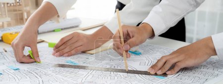 Photo for Worker, architect and engineer work on real estate construction project oratory planning with cartography and cadastral map of urban town area to guide to construction developer business plan of city - Royalty Free Image