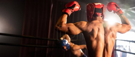 Photo for Boxer and intimidation with victory or winner posing after he won boxing match, confident stance and triumphant expression convey the essence of his hard boxing fighting victory. Spur - Royalty Free Image