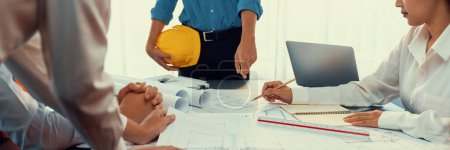 Photo for Engineer partner drawing and working on blueprint design together on office table for architectural building construction project. Architect drafting interior blueprint layout. Insight - Royalty Free Image