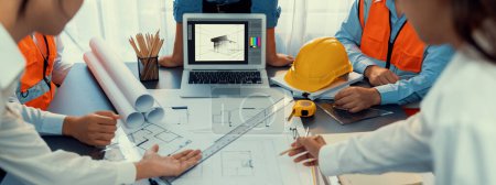 Photo for Engineer and architect working together brainstorming and designing blueprint using laptop working with architectural software for precise digital interior or structure design. Insight - Royalty Free Image