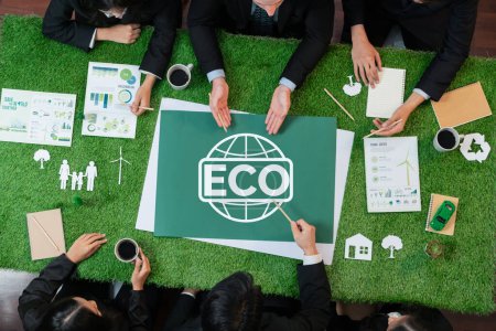 Photo for Top view panoramic ECO symbol on green grass table with business people planning for alternative energy utilization for greener sustainable Earth as corporate social responsibility. Quaint - Royalty Free Image