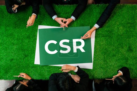 Photo for Top view panoramic CSR symbol on green grass table with business people planning for alternative energy utilization for greener sustainable Earth as corporate social responsibility. Quaint - Royalty Free Image