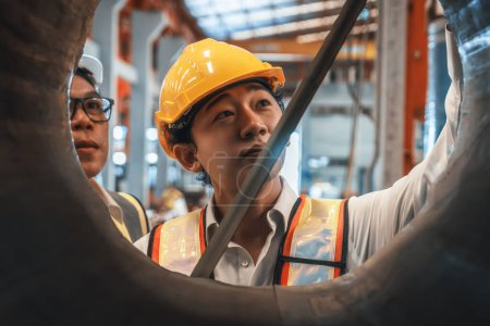 Photo for Engineer team measure size of industrial metal for utmost quality of rolled steel material for heavy construction engineering project. Metalwork manufacturing quality control process. Exemplifying - Royalty Free Image