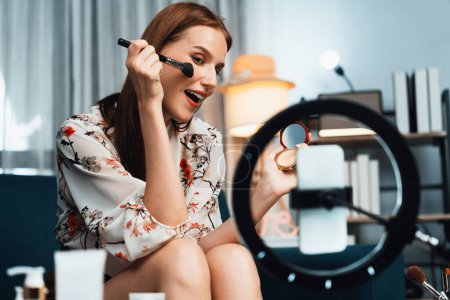Photo for Woman influencer shoot live streaming vlog video review makeup utmost social media or blog. Happy young girl with cosmetics studio lighting for marketing recording session broadcasting online. - Royalty Free Image