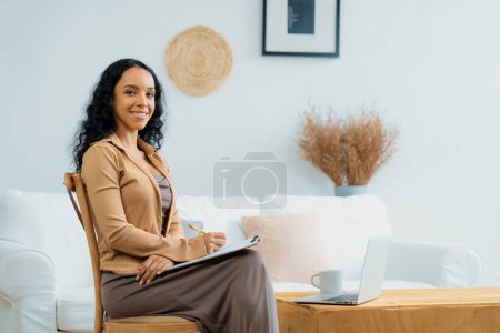 Photo for Psychologist woman in clinic office professional portrait with friendly smile feeling inviting for patient to visit the psychologist. The experienced and confident psychologist is crucial specialist - Royalty Free Image