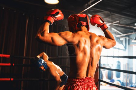 Photo for Boxer and intimidation with victory or winner posing after he won boxing match, confident stance and triumphant expression convey the essence of his hard boxing fighting victory. Impetus - Royalty Free Image