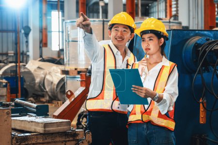 Photo for Professional quality control inspector conduct safety inspection on machinery and manufacturing process in factory. Engineers overseeing process optimization in heavy industry facility. Exemplifying - Royalty Free Image