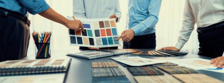 Photo for Group of professional interior designer and architect working together, planning and choosing color samples in office for house design or renovation. Insight - Royalty Free Image