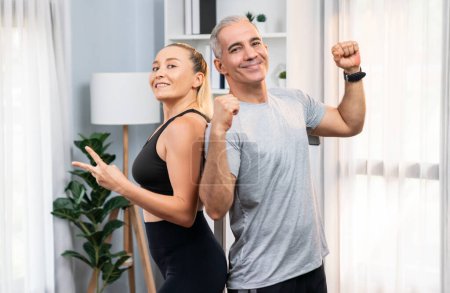 Photo for Athletic and sporty senior couple portrait in sportswear with successful or celebrating after overcome struggle posture as home exercise concept with healthy fit body lifestyle after retirement. Clout - Royalty Free Image