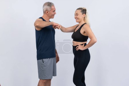 Photo for Active and fit physique senior people portrait with happy smile on isolated background. Healthy lifelong senior couple with fitness healthy and sporty body care lifestyle concept. Clout - Royalty Free Image