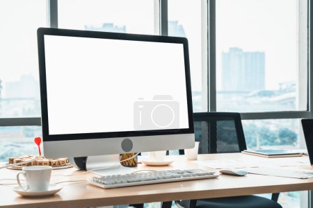Photo for Empty computer monitor screen for design mock up template in modern small office interior or home office. Stylish workplace for creative occupation. Jivy - Royalty Free Image