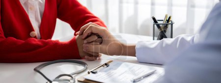 Photo for Patient attend doctors appointment at clinic or hospital office, discussing medical treatment option and explaining diagnostic result while consoling and comforting patient. Panorama Rigid - Royalty Free Image